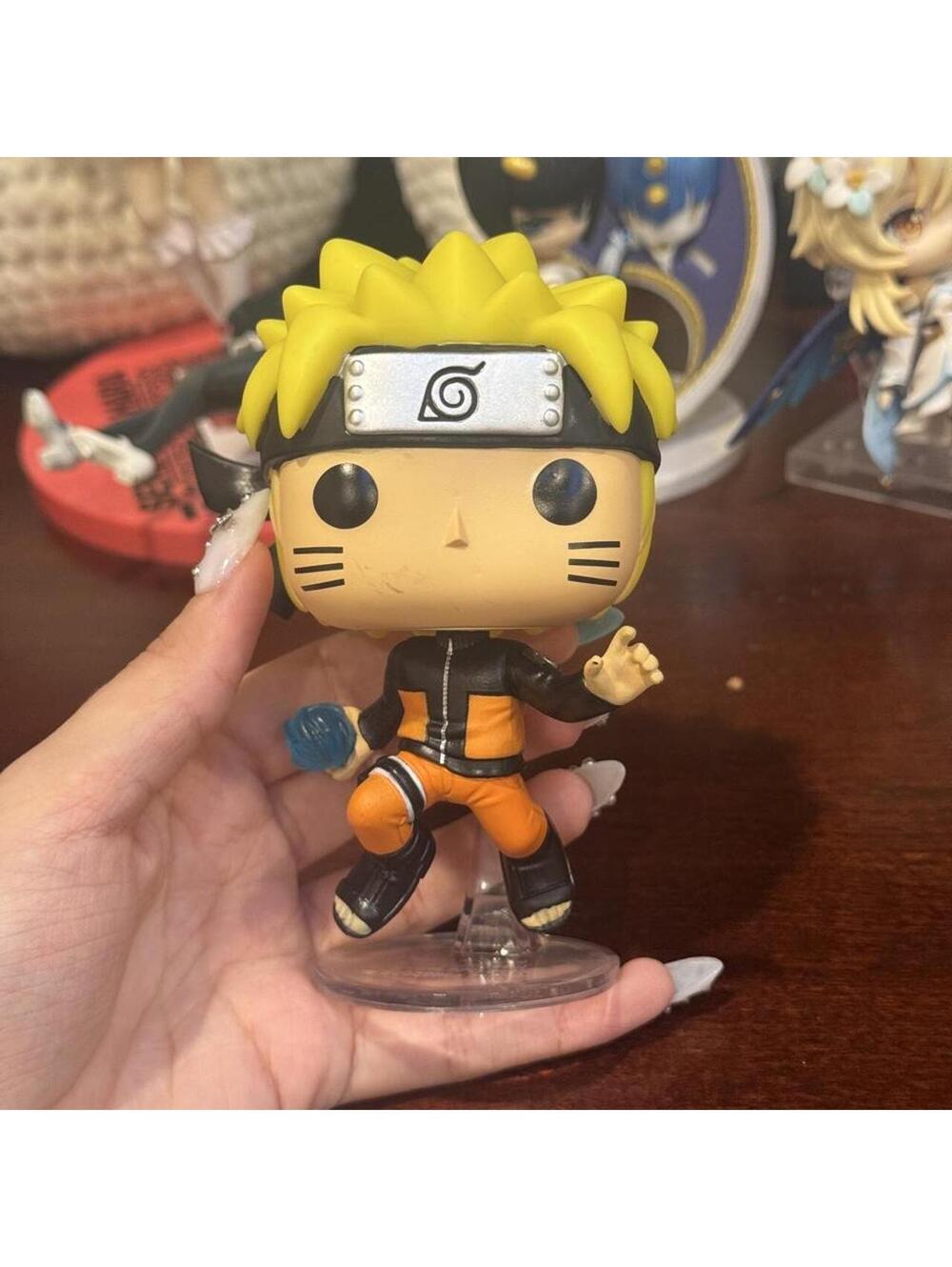 Naruto Funko Pop! figure with orange jumpsuit and black jacket #anime #naruto